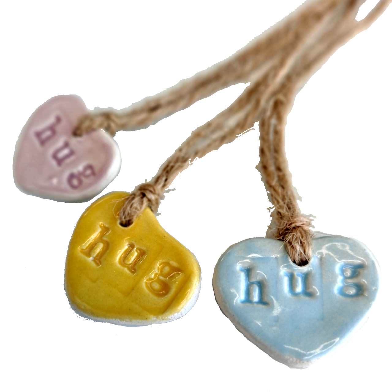 Ceramic heart shaped gift tags imprinted with the word hug