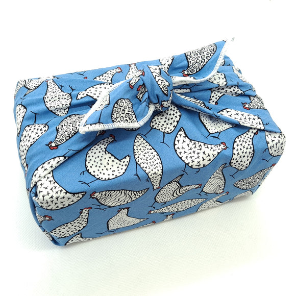 Gift wrapped with furoshiki using happy hens print