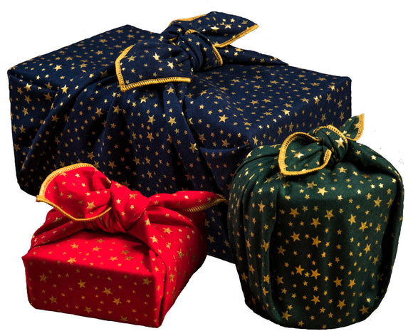 A set of furoshiki fabric wraps in a festive gold stars print