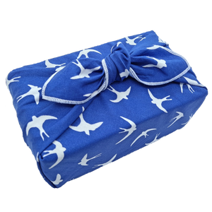 Gift wrapped in a swallow pattern furoshiki