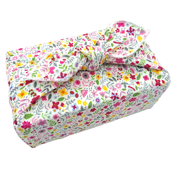 Gift wrapped in a furoshiki with wildflower print